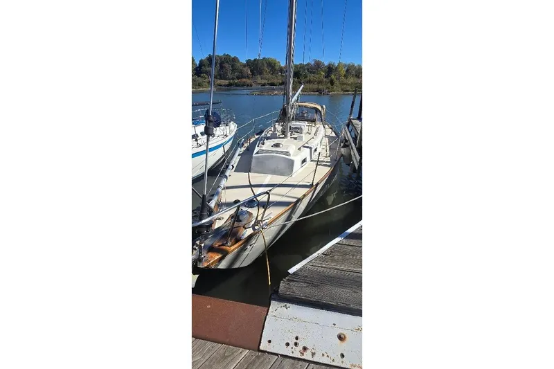 Slide: The Image of 1978 Tartan T34c sailboat docked on a sunny day. - 6