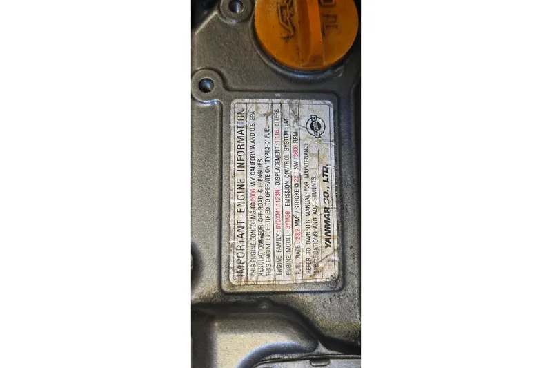 Slide: The Image of 1978 Tartan T34c engine information plate with Yanmar details and specifications. - 65