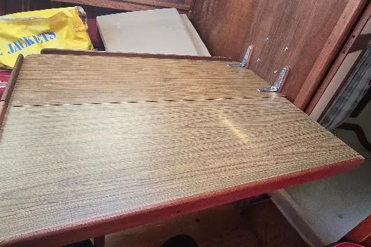 Slide: The Image of Wooden foldable table inside a 1978 Tartan T34c sailboat cabin. - 66
