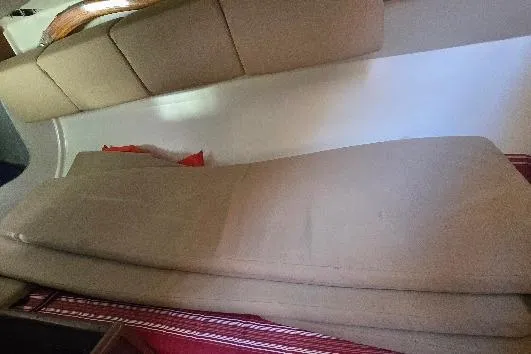 Slide: The Image of Interior seating of a 1978 Tartan T34c sailboat with beige cushions. - 83