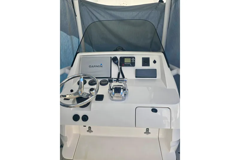 Slide: The Image of 2008 Intrepid 323 OPEN boat dashboard with Garmin navigation system and steering wheel. - 5