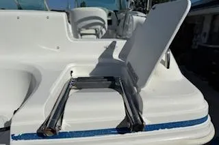 Slide: The Image of 2013 Hurricane SunDeck 187 OB boat with foldable ladder on deck. - 11