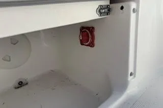 Slide: The Image of 2013 Hurricane SunDeck 187 OB storage compartment with red valve and latch. - 15