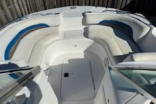 Slide: The Image of 2013 Hurricane SunDeck 187 OB boat interior with white and blue seating. - 2