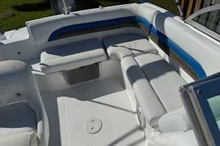 Slide: The Image of 2013 Hurricane SunDeck 187 OB boat interior with white and blue seating. - 4