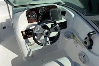 Slide: The Image of 2013 Hurricane SunDeck 187 OB boat dashboard with steering wheel and gauges. - 9