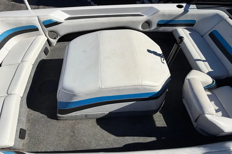 Slide: The Image of 1995 Correct Craft Ski Nautique interior with white and blue seating arrangement. - 27