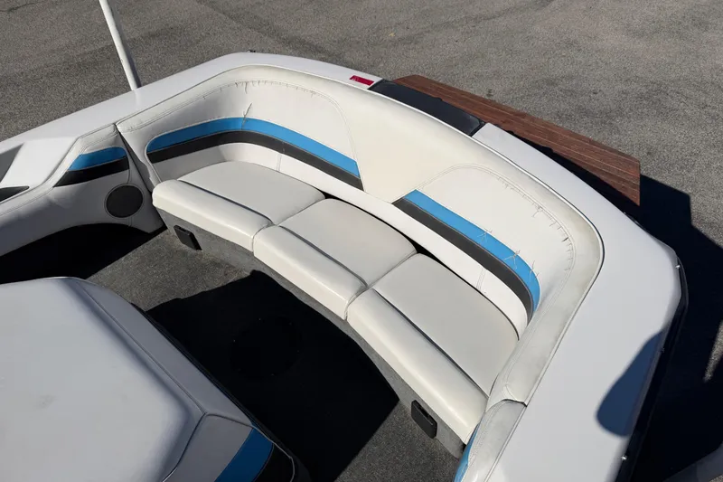 Slide: The Image of 1995 Correct Craft Ski Nautique boat interior with white and blue seating. - 29