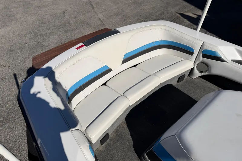 Slide: The Image of 1995 Correct Craft Ski Nautique boat interior with white and blue seating. - 30