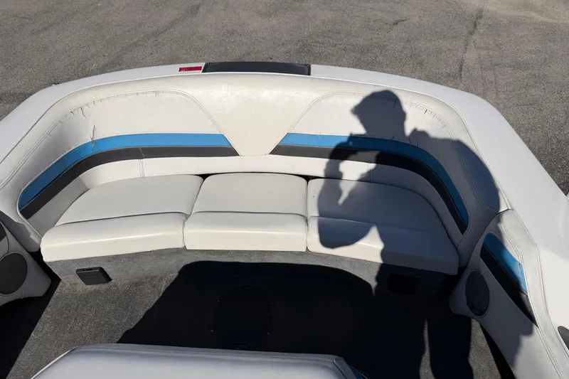 Slide: The Image of 1995 Correct Craft Ski Nautique boat interior with white and blue seating. - 31