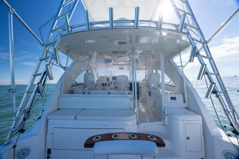 Slide: The Image of 2012 Cabo 40 Hardtop Express yacht interior with ocean view and clear blue sky. - 18