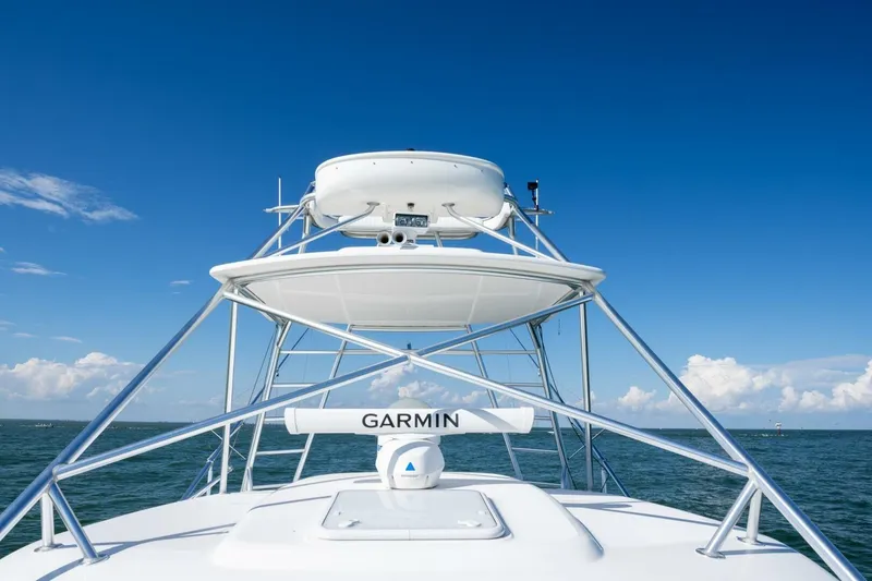 Slide: The Image of Cabo 40 Hardtop Express 2012 boat with Garmin radar, ocean view. - 23