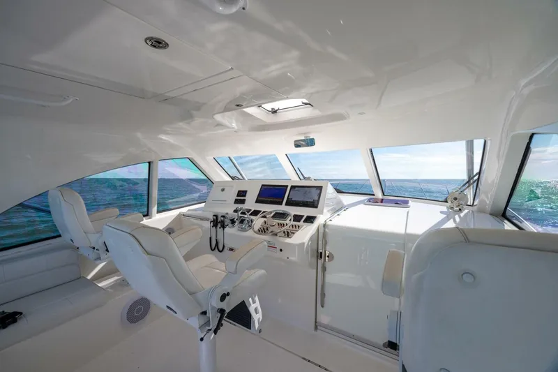 Slide: The Image of Interior of 2012 Cabo 40 Hardtop Express yacht with modern helm and ocean view. - 27