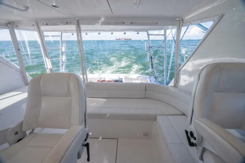 Slide: The Image of Interior view of 2012 Cabo 40 Hardtop Express yacht with ocean backdrop. - 28