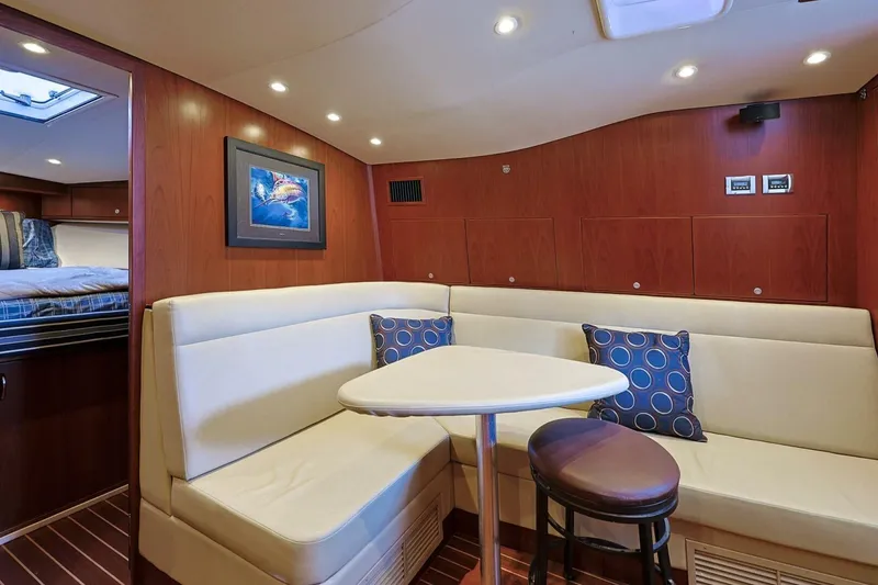 Slide: The Image of Luxurious interior of 2012 Cabo 40 Hardtop Express yacht with cozy seating and elegant decor. - 31