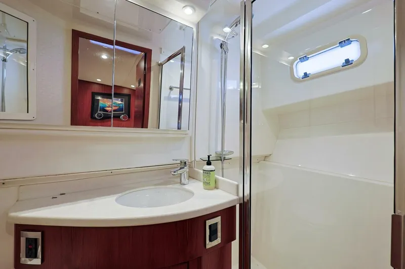Slide: The Image of Luxurious bathroom in 2012 Cabo 40 Hardtop Express yacht with modern fixtures and shower. - 35
