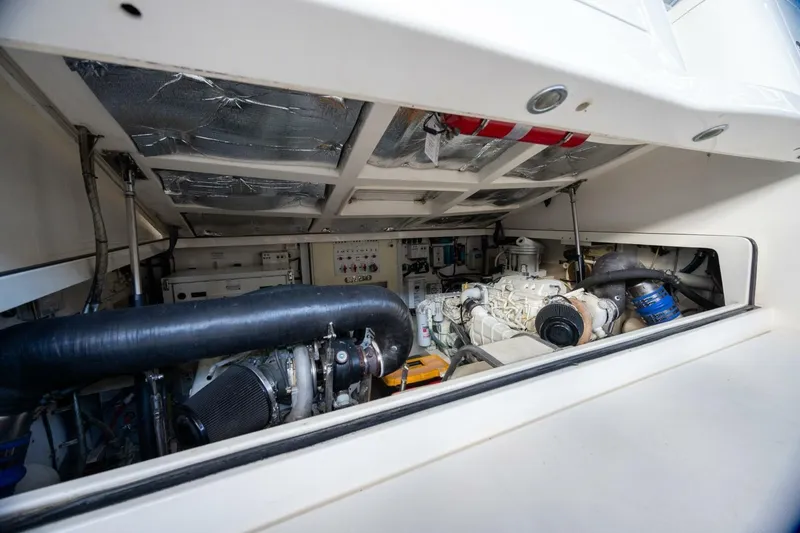 Slide: The Image of Engine room of 2012 Cabo 40 Hardtop Express, showcasing mechanical components and systems. - 39