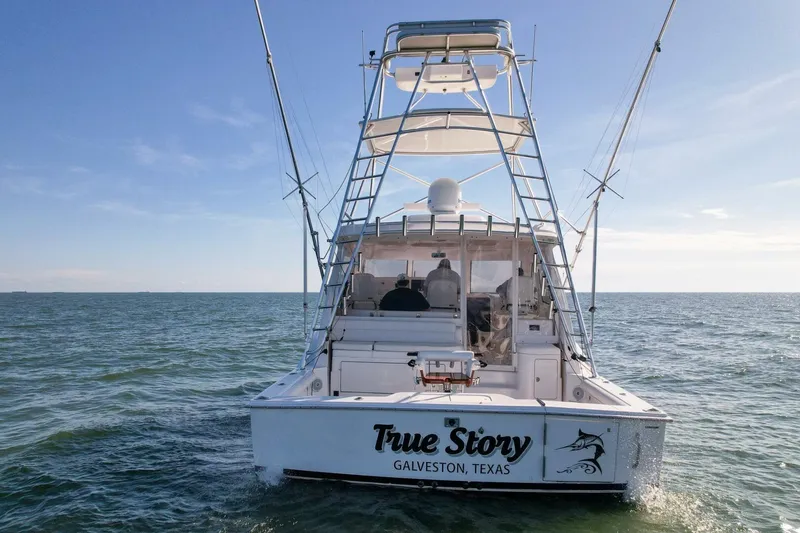 Slide: The Image of 2012 Cabo 40 Hardtop Express boat on open water, Galveston, Texas. - 51