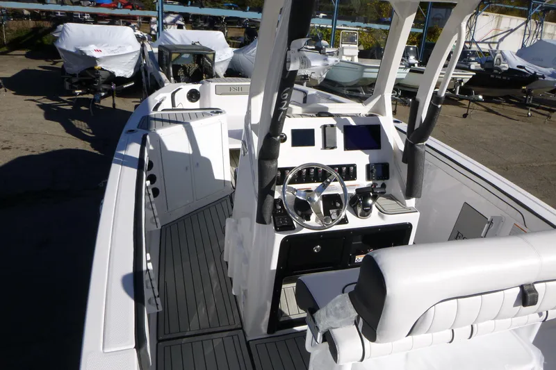 Slide: The Image of 2026 Yamaha Boats 222 FSH Sport E interior with modern dashboard and seating. - 4