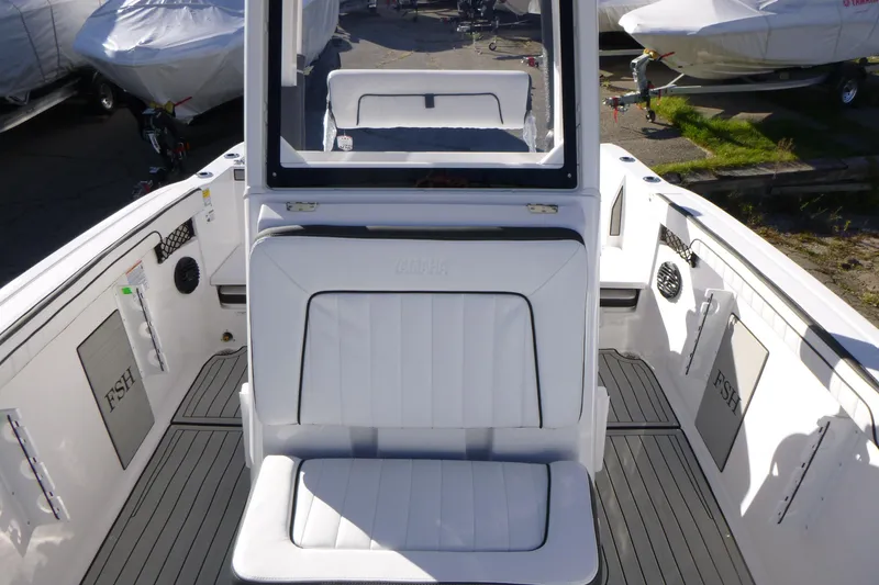 Slide: The Image of 2026 Yamaha Boats 222 FSH Sport E interior with white seating and sleek design. - 5