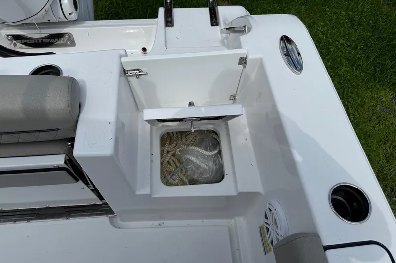 Slide: The Image of 2026 Sportsman Open 252 Center Console boat with open storage compartment and seating. - 11
