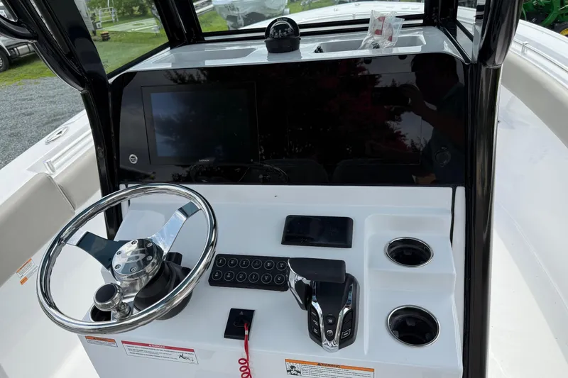 Slide: The Image of 2026 Sportsman Open 252 Center Console dashboard with steering wheel and controls. - 16