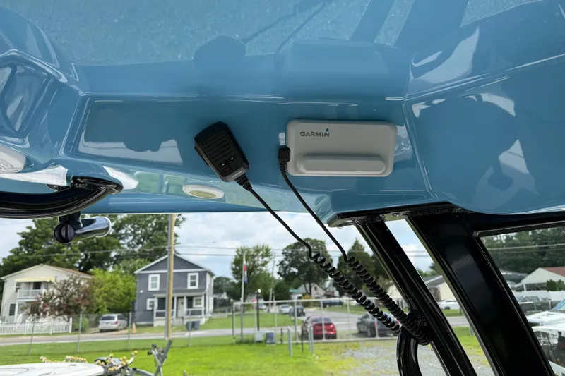 Slide: The Image of 2026 Sportsman Open 252 Center Console with Garmin device and microphone installed. - 18