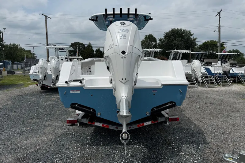 Slide: The Image of 2026 Sportsman Open 252 Center Console boat on trailer, rear view. - 2