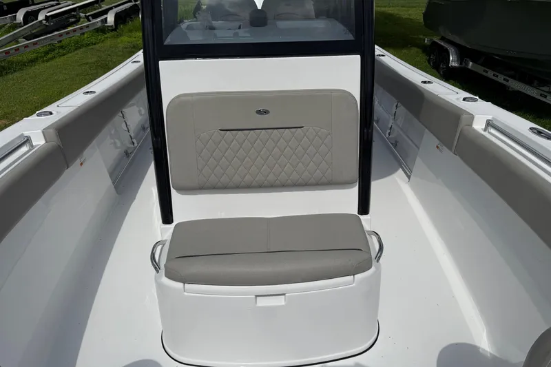 Slide: The Image of 2026 Sportsman Open 252 Center Console boat interior with cushioned seating and sleek design. - 21