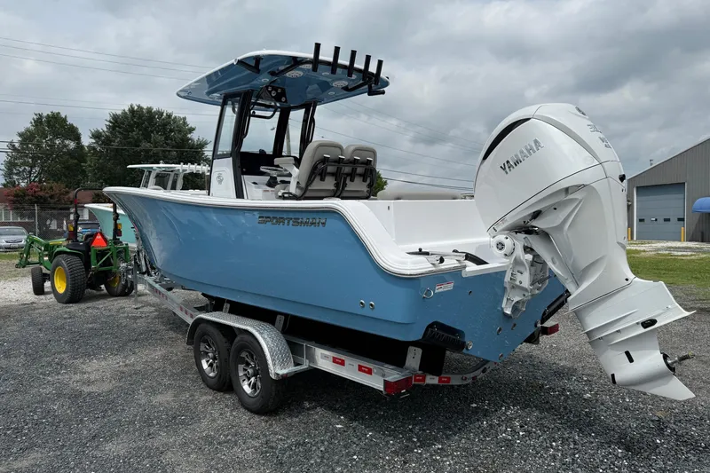 Slide: The Image of 2026 Sportsman Open 252 Center Console boat on trailer with Yamaha outboard motor. - 5