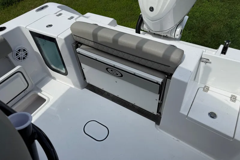 Slide: The Image of 2026 Sportsman Open 252 Center Console boat interior with seating and storage compartments. - 8