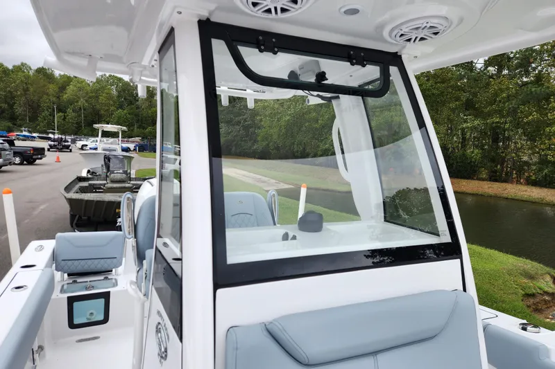 Slide: The Image of 2026 Sportsman Heritage 231 Center Console boat, featuring sleek design and modern amenities. - 13
