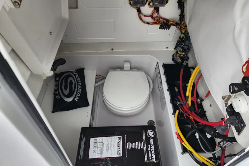 Slide: The Image of 2026 Sportsman Heritage 231 Center Console boat interior with wiring and equipment. - 14