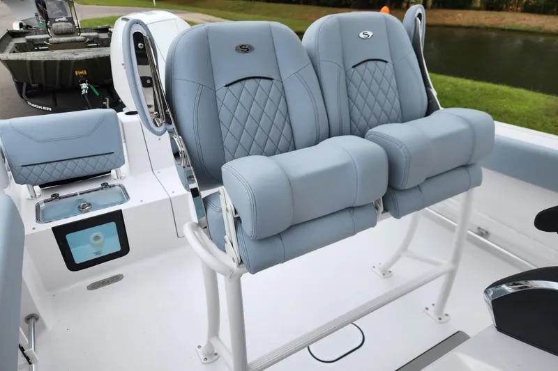 Slide: The Image of 2026 Sportsman Heritage 231 Center Console boat with luxurious seating and modern design. - 18