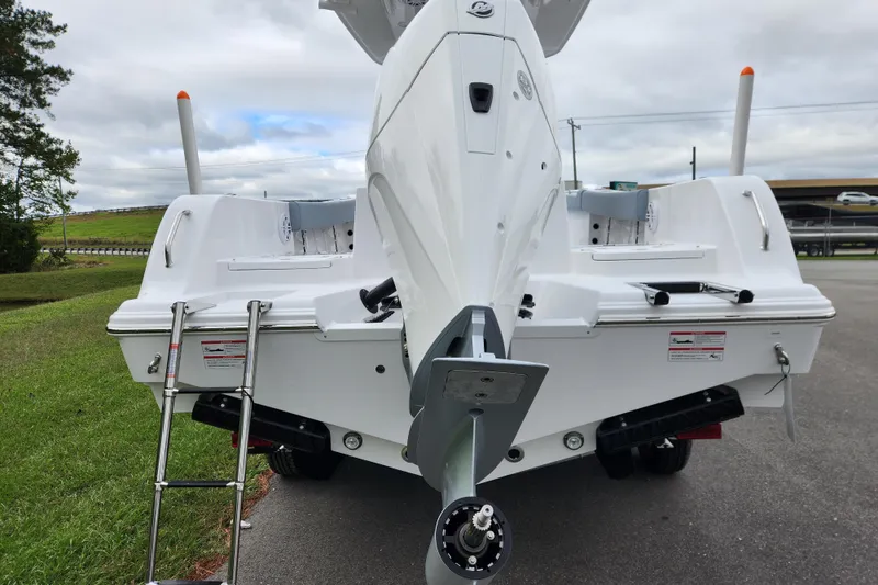Slide: The Image of 2026 Sportsman Heritage 231 Center Console boat, rear view with ladder and propeller. - 3