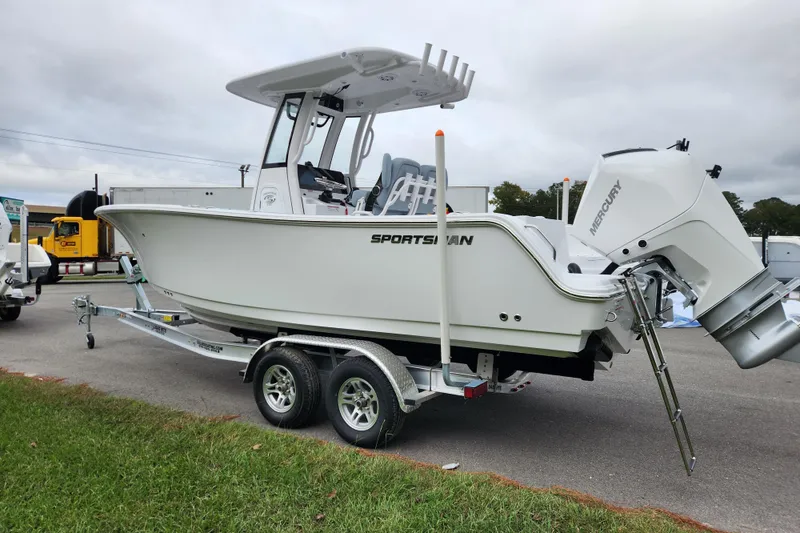 Slide: The Image of 2026 Sportsman Heritage 231 Center Console boat on trailer, featuring Mercury outboard engine. - 4