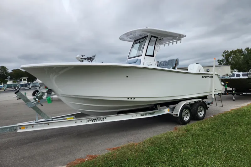 Slide: The Image of 2026 Sportsman Heritage 231 Center Console boat on trailer, parked outdoors. - 6