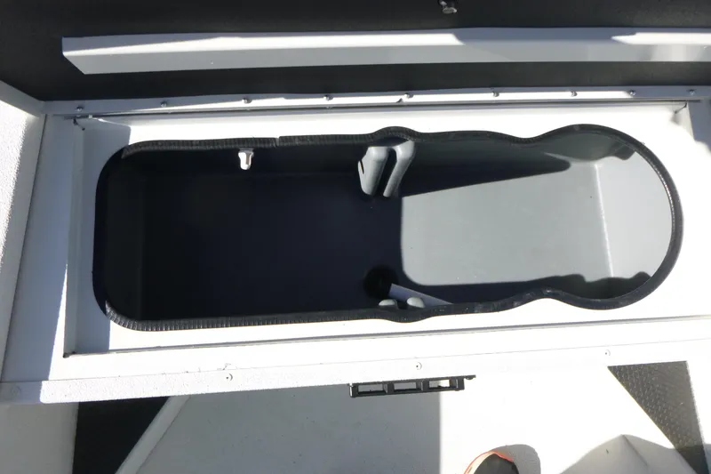Slide: The Image of Open storage compartment in 2025 Ranger RB210 boat. - 12