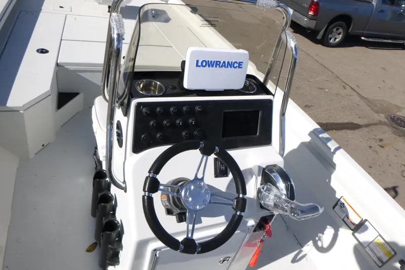 Slide: The Image of 2025 Ranger RB210 boat console with steering wheel and Lowrance navigation system. - 13
