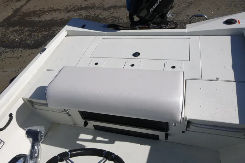 Slide: The Image of 2025 Ranger RB210 boat interior with white seating and steering wheel. - 14