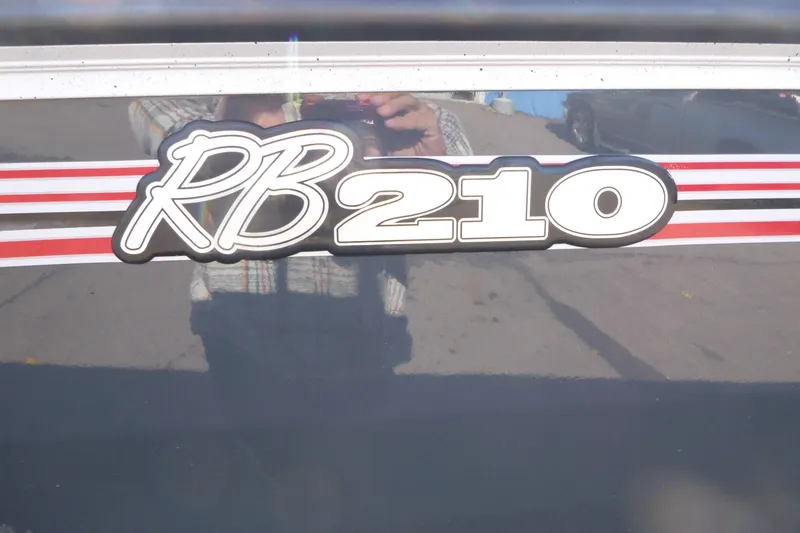 Slide: The Image of Ranger RB210 2025 model logo with red and white stripes. - 17
