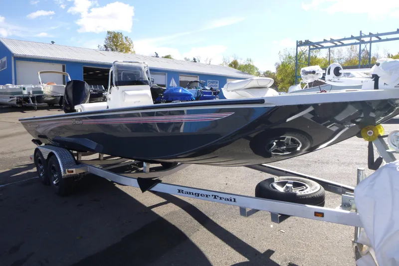 Slide: The Image of 2025 Ranger RB210 boat on trailer in outdoor dealership lot. - 4