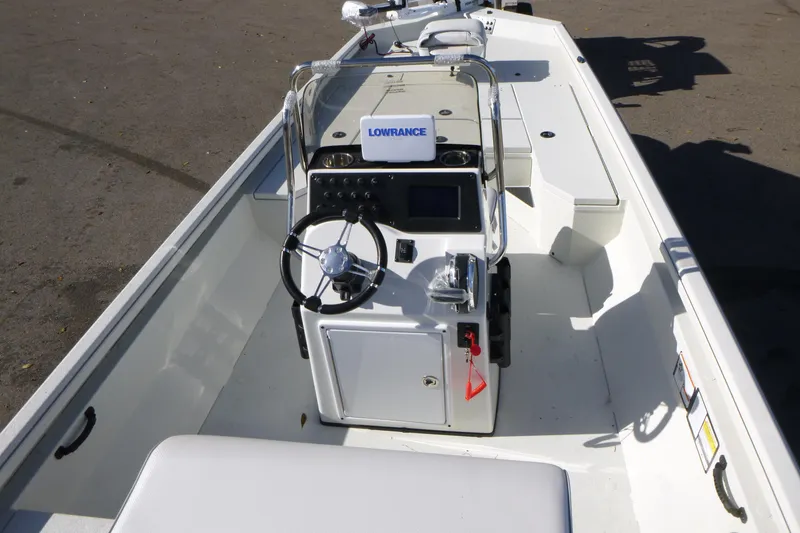 Slide: The Image of 2025 Ranger RB210 boat interior with steering console and seating. - 5