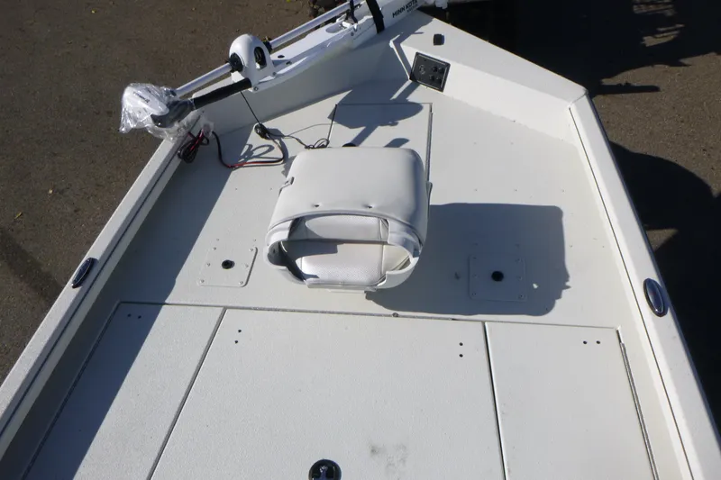 Slide: The Image of 2025 Ranger RB210 boat deck with white seat and trolling motor. - 7