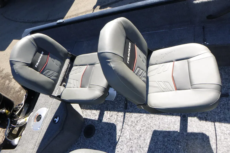 Slide: The Image of 2026 Tracker Pro Guide V-16 SC boat seats, gray with red accents, top view. - 11