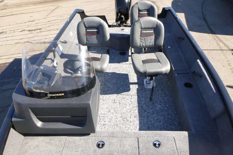 Slide: The Image of 2026 Tracker Pro Guide V-16 SC boat interior with seating and steering console. - 5