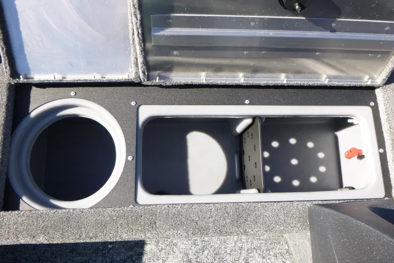 Slide: The Image of 2026 Tracker Pro Guide V-16 SC boat storage compartments, featuring circular and rectangular spaces. - 8