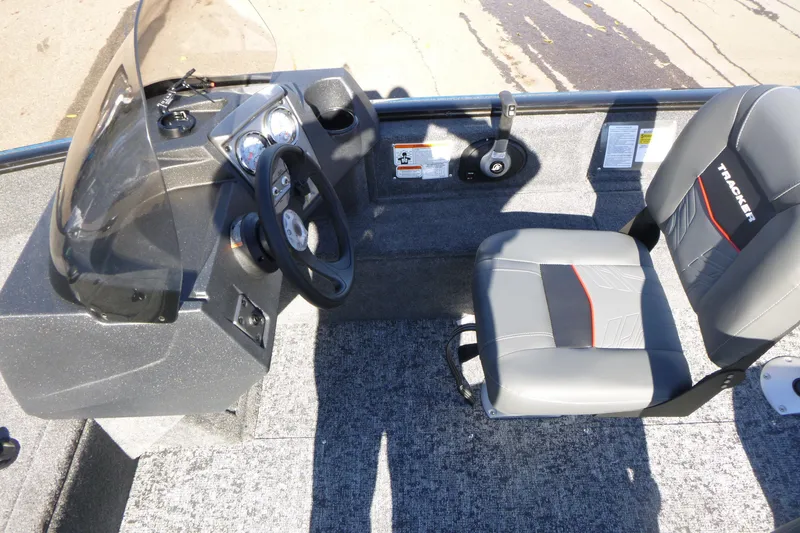 Slide: The Image of 2026 Tracker Pro Guide V-16 SC boat interior with steering console and seat. - 9