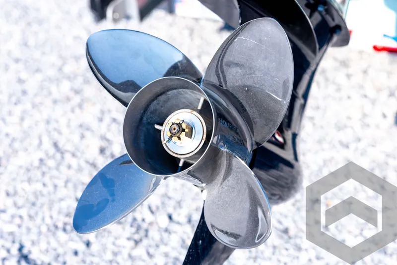 Slide: The Image of Close-up of a 2026 Pathfinder 2200 TRS boat propeller on gravel background. - 17
