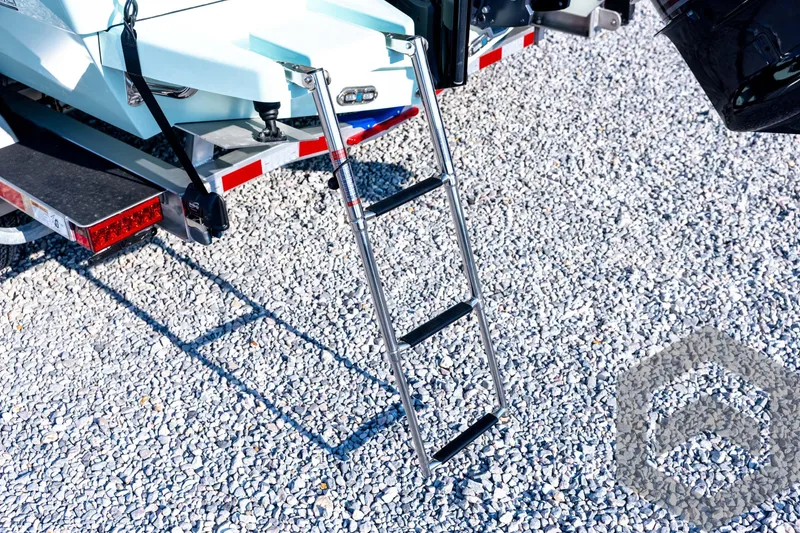 Slide: The Image of 2026 Pathfinder 2200 TRS boat ladder on gravel surface, rear view. - 24